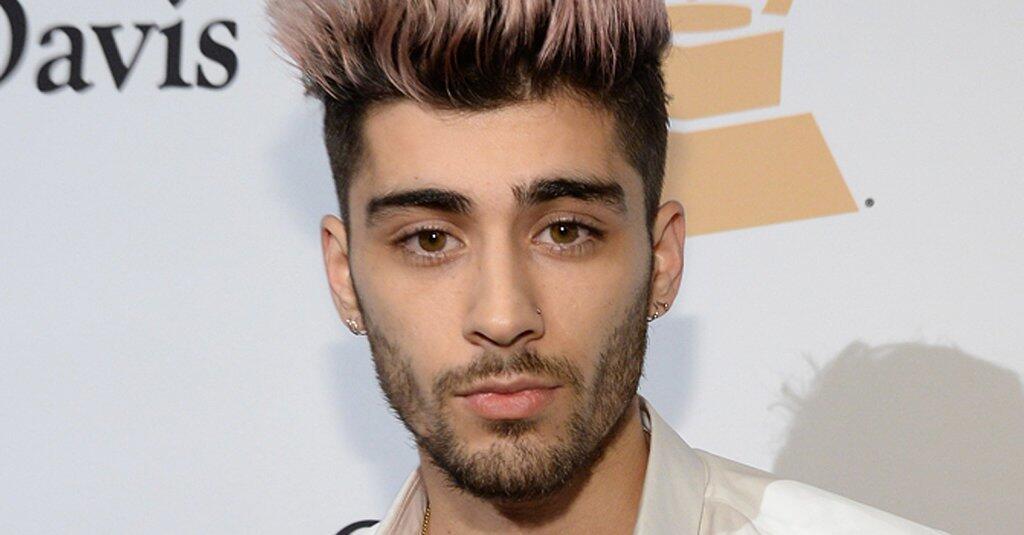 Zayn Malik, a British singer and songwriter, with a pink and black hairstyle.