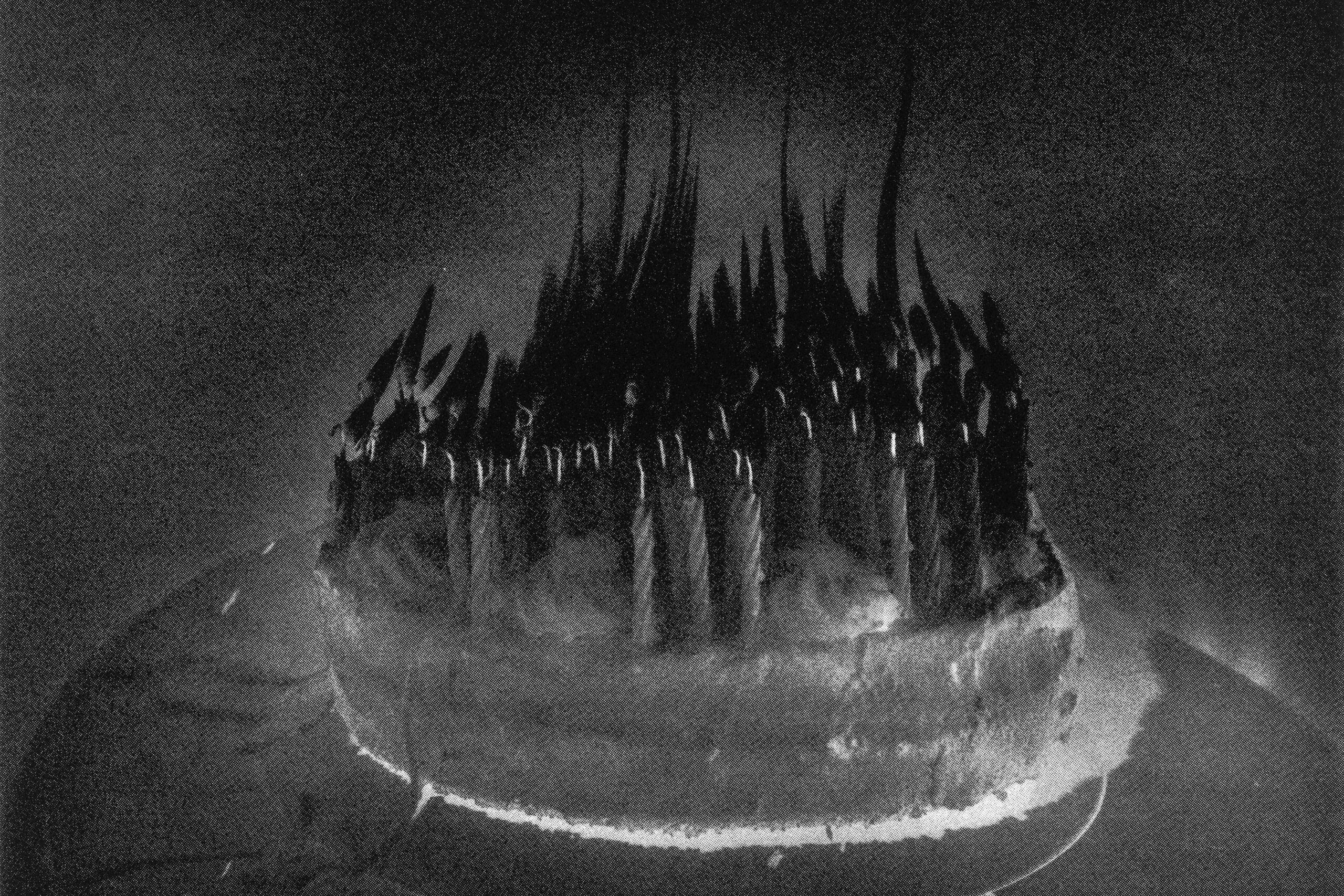 A black and white photo of lit candles on a birthday cake representing the search query 'Photos depicting mass hysteria phenomenon'.