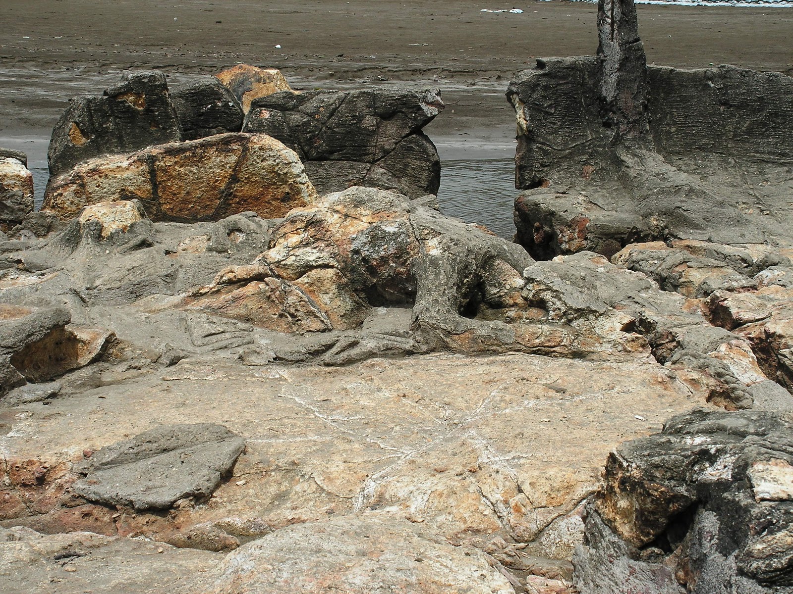 A pile of rocks on a beach that is said to be the remains of a man named Malin Kundang who was turned to stone as punishment for his disobedience to his mother.