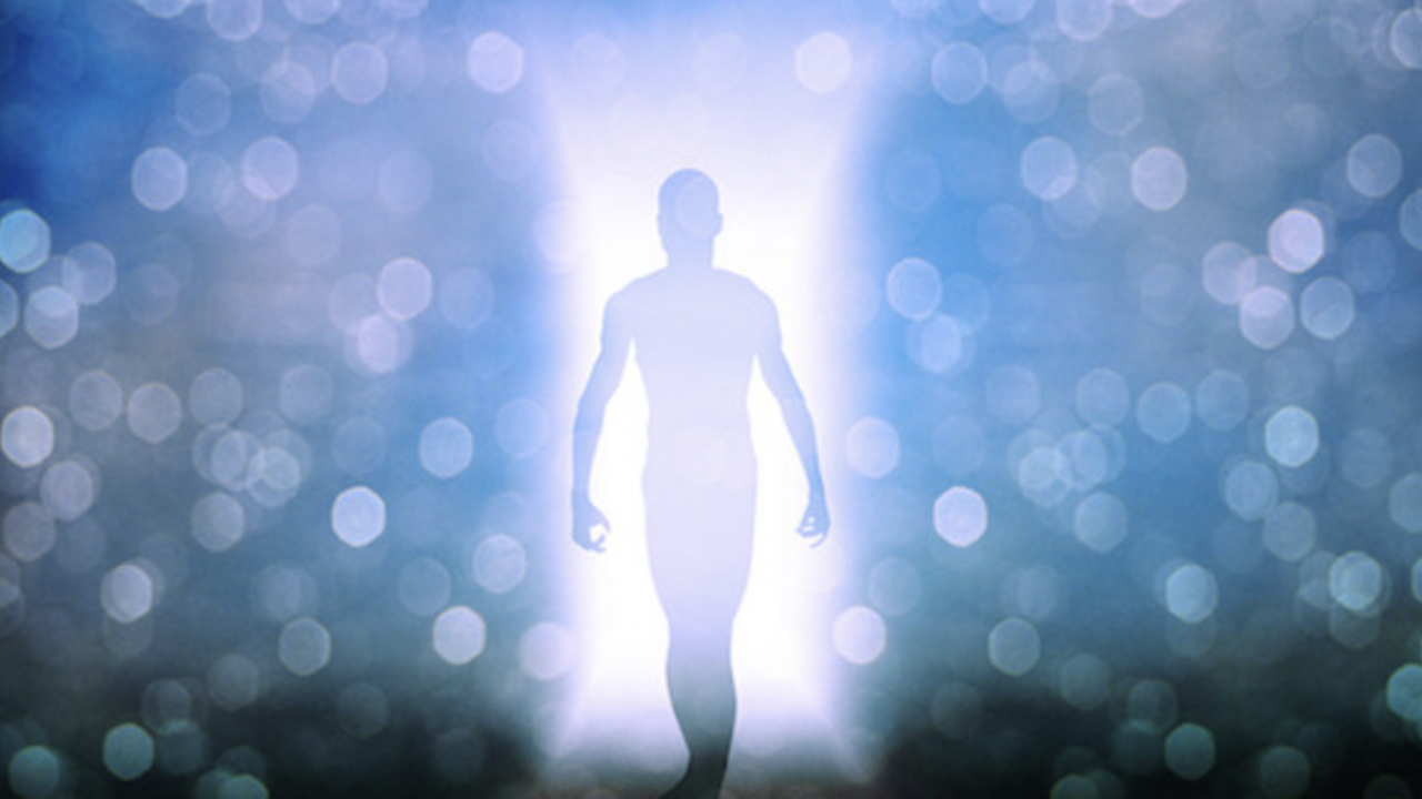 A blue and purple colored aura surrounds a person shaped figure.